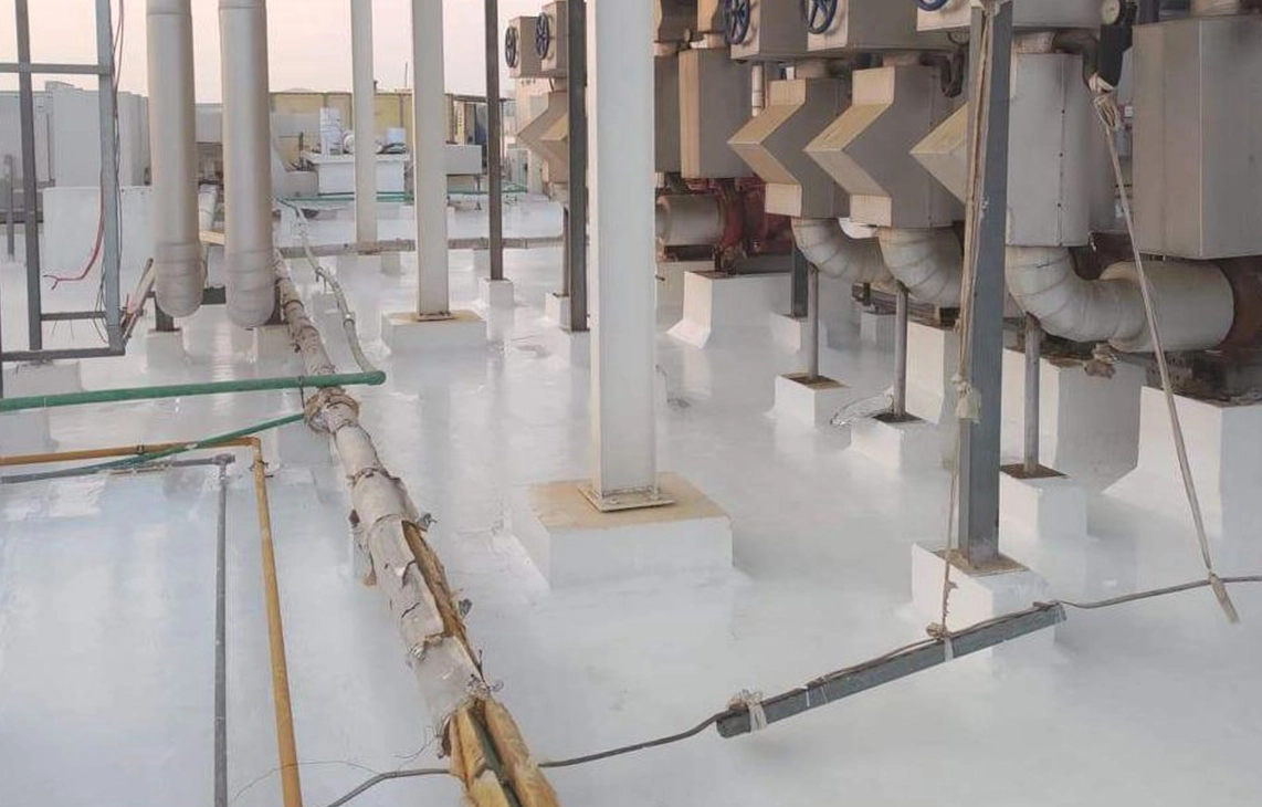 Commercial TPO roof with coated surface around rooftop equipment