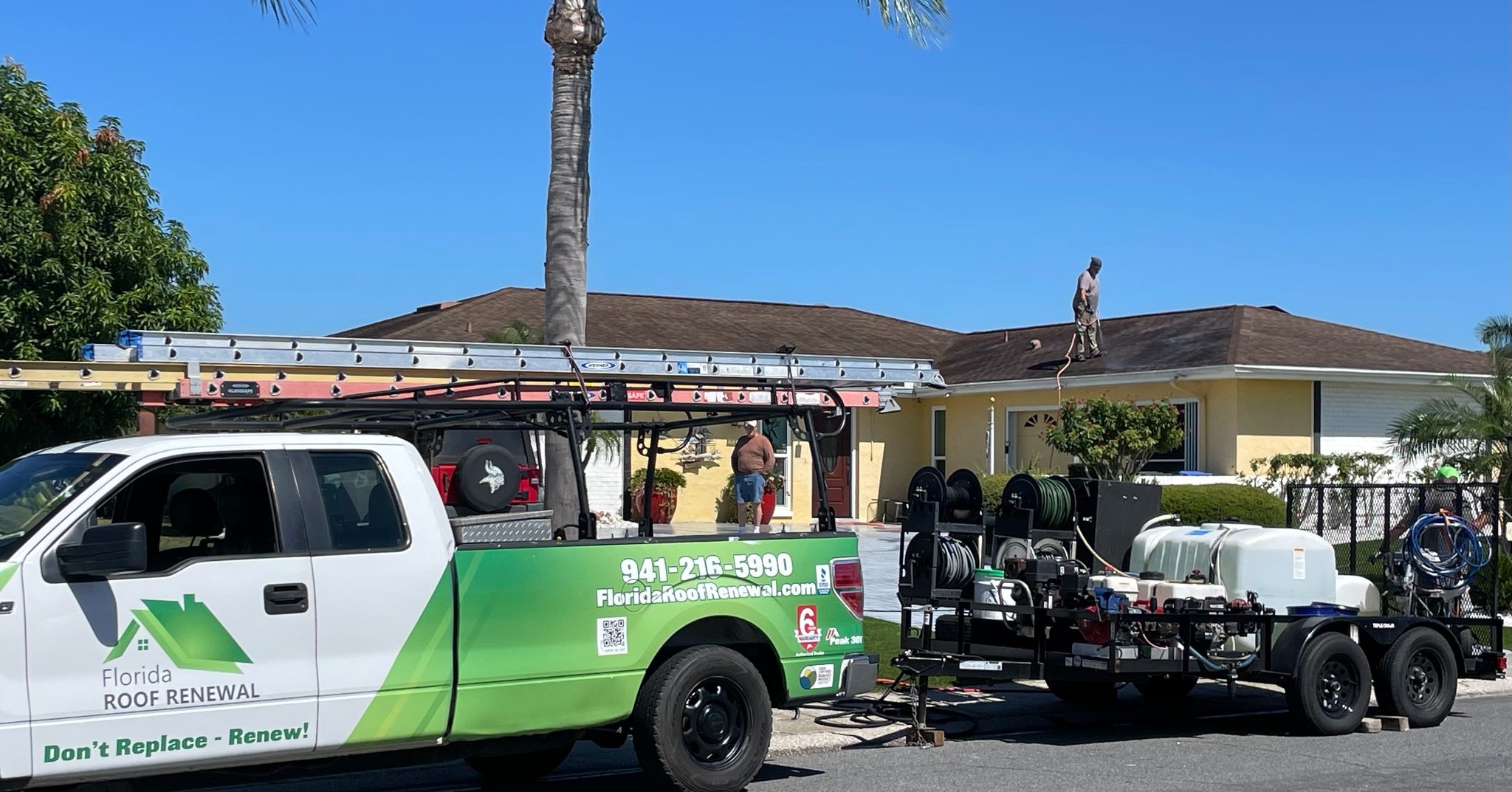 Florida Roof Renewal truck and crew at a home