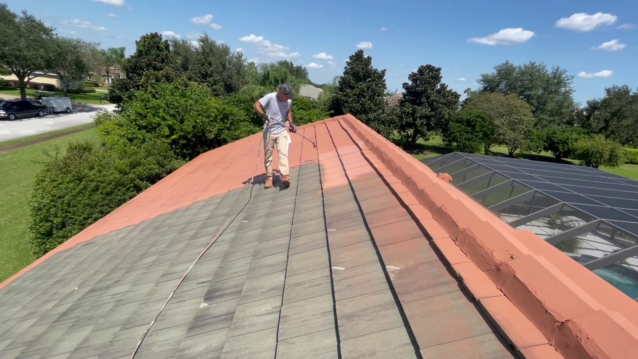 Crew member working on a tile roof