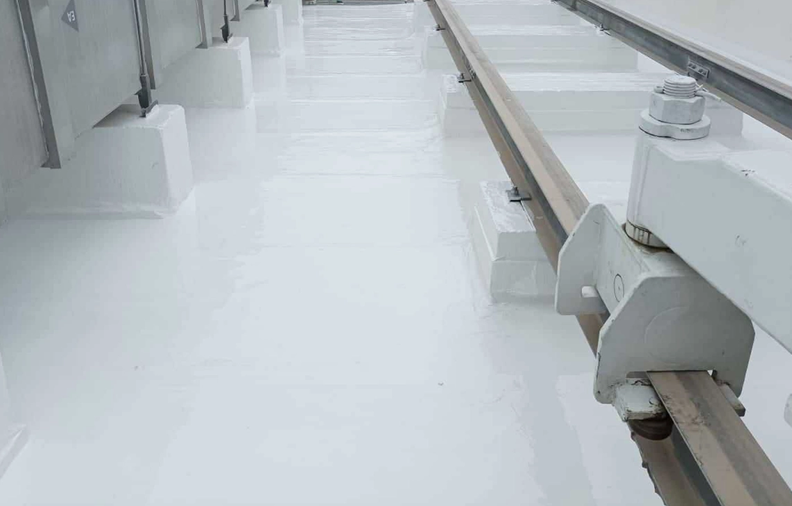 Silicone-coated commercial roof with sealed penetrations and reinforced supports