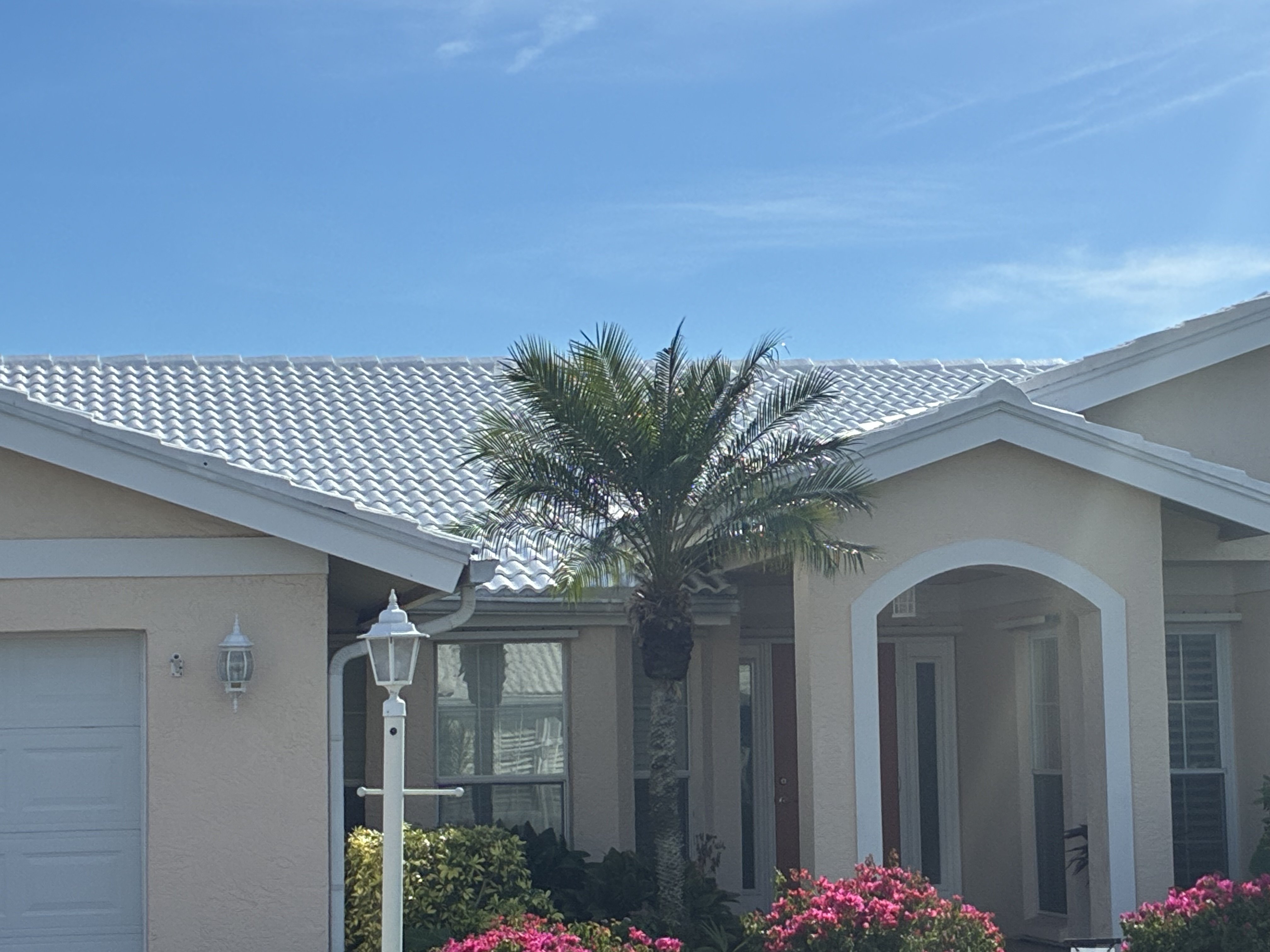 Florida home with a prominent white barrel tile roof after sealing